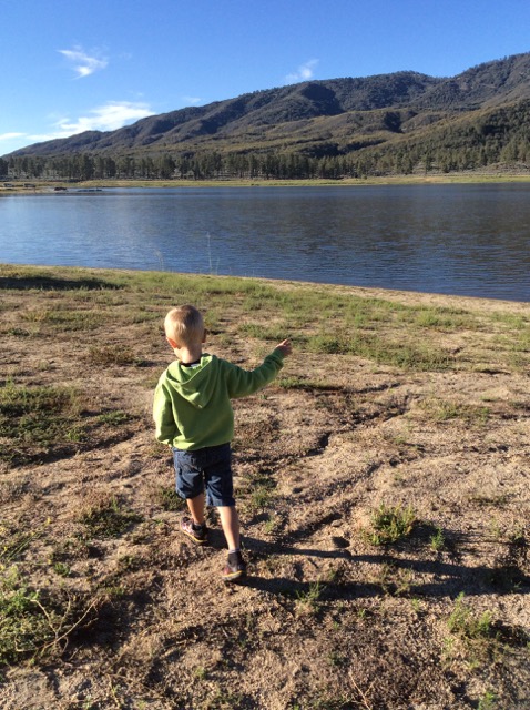 A photo of Hiatt walking by the lake